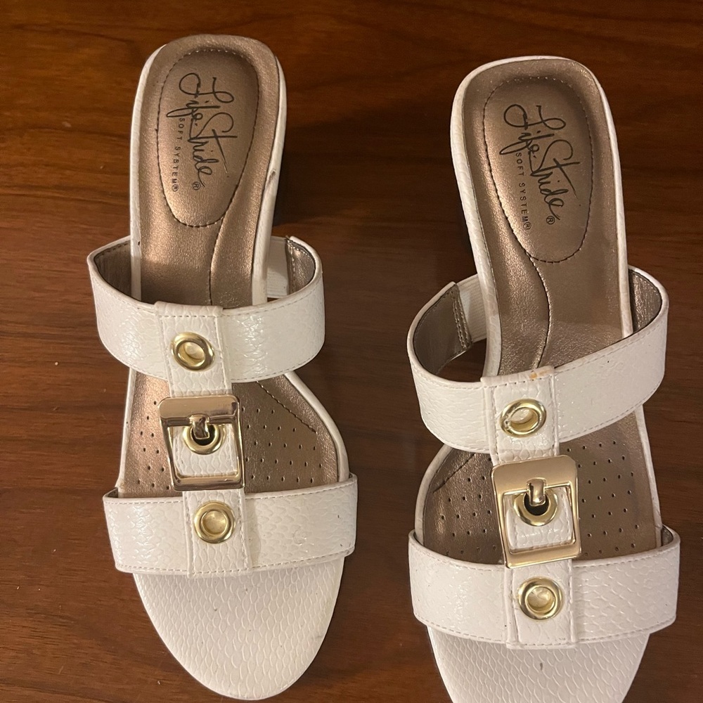 Cream Sandal with decorative gold finish straps.  Life Stride Soft System.